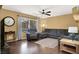 Bright living room with a large window and comfortable seating at 7437 Treasure Chest St, Las Vegas, NV 89139