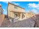 Spacious backyard featuring a covered patio and brick pavers at 7707 W Diablo Dr, Las Vegas, NV 89113