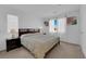 Comfortable bedroom featuring a queen bed, a window with blinds, and simple décor at 7707 W Diablo Dr, Las Vegas, NV 89113