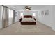 Spacious bedroom with a ceiling fan and decorative rug, featuring a plush bed at 7707 W Diablo Dr, Las Vegas, NV 89113