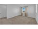 Spacious bedroom with neutral carpet and paint, sliding door closet, a window and plenty of natural light at 7707 W Diablo Dr, Las Vegas, NV 89113