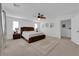 Large bedroom features a ceiling fan and dark furnishings, providing comfort and style at 7707 W Diablo Dr, Las Vegas, NV 89113
