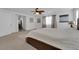 Bright bedroom featuring a large bed with neutral bedding and a ceiling fan at 7707 W Diablo Dr, Las Vegas, NV 89113