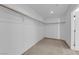 Spacious walk-in closet featuring neutral carpeting and built in organizers at 7707 W Diablo Dr, Las Vegas, NV 89113