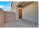 Private courtyard with brick pavers leading to the home's entryway at 7707 W Diablo Dr, Las Vegas, NV 89113