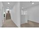 Well-lit upstairs hallway with neutral carpeting at 7707 W Diablo Dr, Las Vegas, NV 89113