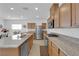 Spacious kitchen with granite countertops, stainless steel appliances and wood cabinets at 7707 W Diablo Dr, Las Vegas, NV 89113
