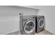Laundry room featuring a side by side washer and dryer, and white shelving at 7707 W Diablo Dr, Las Vegas, NV 89113