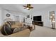 Open living space with carpet, white walls and staircase at 7707 W Diablo Dr, Las Vegas, NV 89113