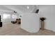 Spacious living room with a staircase, neutral colored walls, tiled floor, carpet and modern decor at 7707 W Diablo Dr, Las Vegas, NV 89113