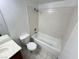Bright bathroom featuring a tiled shower-tub combo and white fixtures at 7948 Calico Vista Blvd # 101, Las Vegas, NV 89128