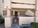 Inviting condo exterior with gated patio and detailed stonework columns at 7948 Calico Vista Blvd # 101, Las Vegas, NV 89128
