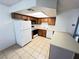 Functional kitchen featuring appliances, cabinets, and a tile floor at 7948 Calico Vista Blvd # 101, Las Vegas, NV 89128