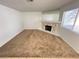 Inviting living room with plush carpeting and cozy stone fireplace at 7948 Calico Vista Blvd # 101, Las Vegas, NV 89128