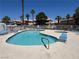 Community swimming pool and spa on a clear day with poolside seating at 7948 Calico Vista Blvd # 101, Las Vegas, NV 89128