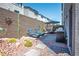 Backyard oasis featuring lounge chairs, built-in grill, and desert-inspired landscaping at 8175 Caldera Creek St, Las Vegas, NV 89113