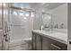 Modern bathroom featuring vanity with white countertop and a glass-enclosed shower at 8175 Caldera Creek St, Las Vegas, NV 89113