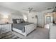 This spacious bedroom features a ceiling fan, plush carpet, and a calming color palette for relaxation at 8175 Caldera Creek St, Las Vegas, NV 89113