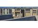 View of modern townhomes with rooftop balconies, offering a glimpse of the city skyline in the background at 8175 Caldera Creek St, Las Vegas, NV 89113