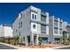 Modern three-story townhome featuring a private balcony and a desert-landscaped front yard at 8175 Caldera Creek St, Las Vegas, NV 89113