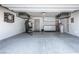A well-organized garage features overhead storage, cabinets, and epoxy flooring, creating a clean and functional space at 8175 Caldera Creek St, Las Vegas, NV 89113