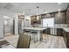 Bright kitchen featuring a central island, stainless steel appliances, and sleek countertops at 8175 Caldera Creek St, Las Vegas, NV 89113