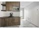Compact kitchenette featuring modern cabinets, stainless steel microwave, and a convenient coffee maker at 8175 Caldera Creek St, Las Vegas, NV 89113