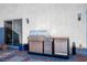 Outdoor kitchen area featuring a built-in grill and countertop space with a sliding glass door nearby at 8175 Caldera Creek St, Las Vegas, NV 89113