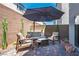 Covered patio with comfortable seating, perfect for outdoor relaxation and entertaining at 8175 Caldera Creek St, Las Vegas, NV 89113