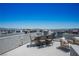 A rooftop terrace with dining and lounge seating offers stunning views of the surrounding area at 8175 Caldera Creek St, Las Vegas, NV 89113