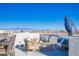 Comfortable rooftop terrace featuring lounge seating, wicker chairs, and city views at 8175 Caldera Creek St, Las Vegas, NV 89113