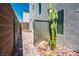 View of a fenced side yard with desert-style landscaping and a brick paver walkway at 8175 Caldera Creek St, Las Vegas, NV 89113