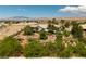 This aerial view highlights the home's desert landscaping and mountain views at 8290 Gagnier Blvd, Las Vegas, NV 89113
