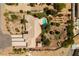 Expansive estate featuring a private pool, ample parking, mature landscaping, and desert landscape, nestled in the desert at 8290 Gagnier Blvd, Las Vegas, NV 89113