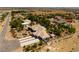 Bird's eye view of a sprawling estate with mature trees, a private yard, and an extensive driveway at 8290 Gagnier Blvd, Las Vegas, NV 89113