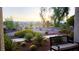 Bench overlooking a professionally landscaped desert yard with walking paths, mature trees, plants and community views at 8290 Gagnier Blvd, Las Vegas, NV 89113
