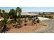 Beautiful single-story home with lush landscaping creating a serene and inviting curb appeal at 8290 Gagnier Blvd, Las Vegas, NV 89113