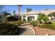 Charming single story home with landscaped front yard and walkway to front door at 8290 Gagnier Blvd, Las Vegas, NV 89113