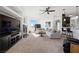 Bright and airy living room with fireplace, plush sofas, carpeted floors, and easy access to kitchen at 8290 Gagnier Blvd, Las Vegas, NV 89113