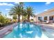 Beautiful pool area with mature palm trees provides a tropical oasis for relaxation and enjoyment at 8290 Gagnier Blvd, Las Vegas, NV 89113
