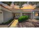 Close-up of the inviting home entrance showing double doors, mature landscaping and well-maintained walkway at 8813 Sundial Dr, Las Vegas, NV 89134
