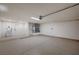 Spacious garage features epoxy floors, sink, and ample storage space at 8813 Sundial Dr, Las Vegas, NV 89134