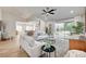 Bright living room with vaulted ceilings, modern furniture, and an open floor plan at 8813 Sundial Dr, Las Vegas, NV 89134