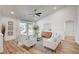 Bright living room with vaulted ceilings, neutral decor, and sliding glass doors to the backyard at 8813 Sundial Dr, Las Vegas, NV 89134