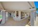 The spacious covered patio offers ample seating and beautiful views through multiple windows and doors at 8813 Sundial Dr, Las Vegas, NV 89134