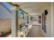 Covered patio featuring a small table with two chairs, ideal for enjoying the outdoor space at 8813 Sundial Dr, Las Vegas, NV 89134