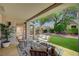 The covered patio has comfortable seating and lush landscaping, creating a relaxing outdoor retreat at 8813 Sundial Dr, Las Vegas, NV 89134