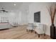 Stylish sitting area with comfortable chairs, wood-look floors, and modern decor at 8813 Sundial Dr, Las Vegas, NV 89134