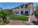 Expansive backyard with manicured lawn and patio, perfect for outdoor living and entertaining at 8820 Fall Green Ave, Las Vegas, NV 89129