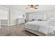 Bright bedroom featuring a large bay window, neutral walls, soft carpet, and ample natural light at 8820 Fall Green Ave, Las Vegas, NV 89129
